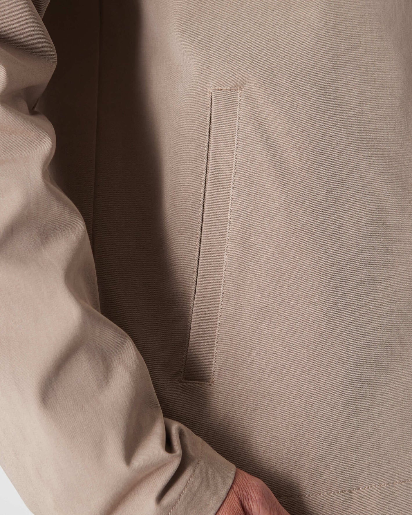 Khaki Coaches Jacket with welt pocket and snap button cuff.