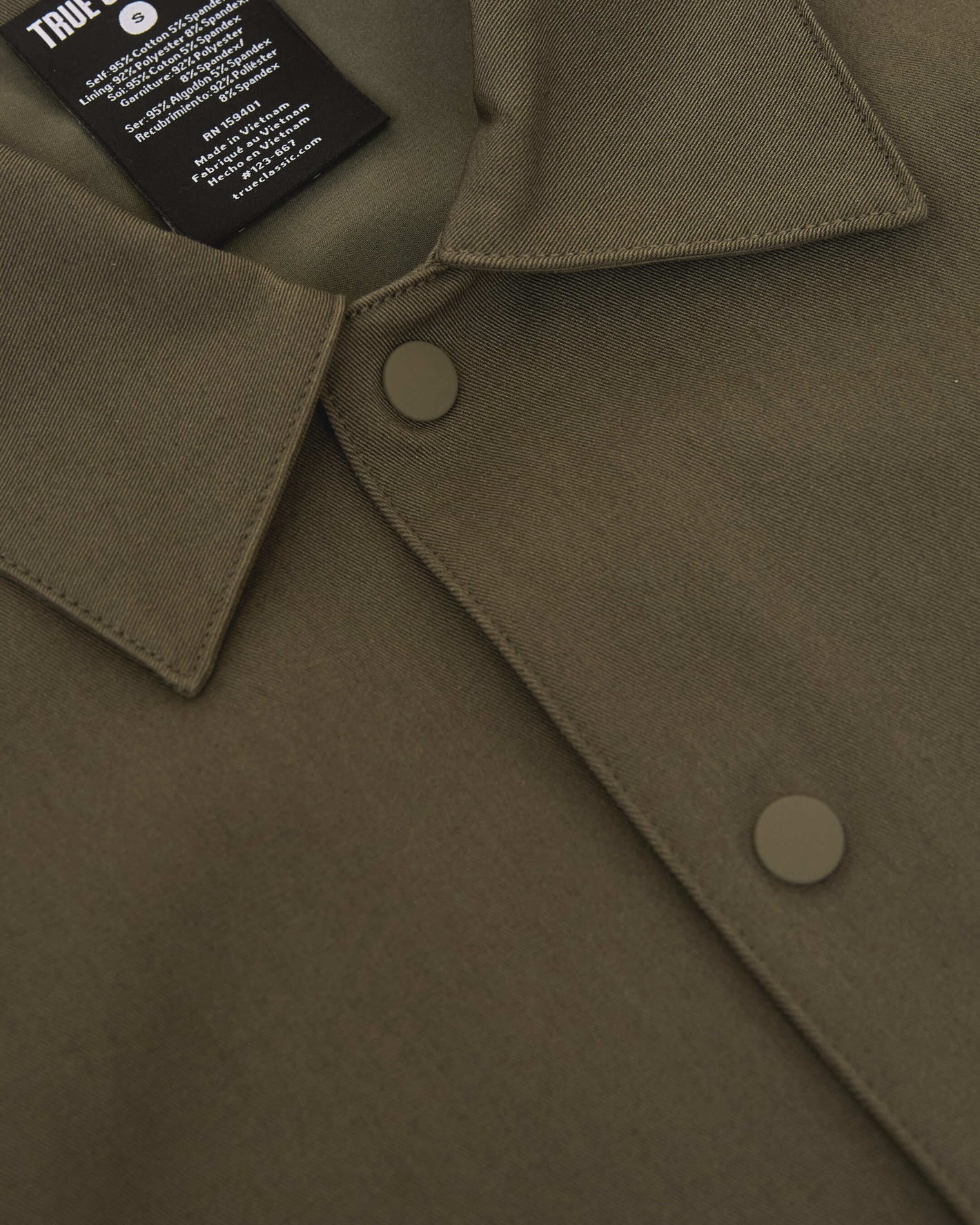 Military Green Coaches Jacket with snap buttons and TRUE CLASSIC label.