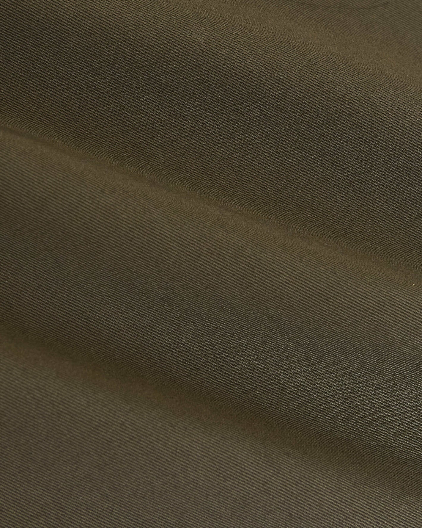 Military Green Coaches Jacket showing olive-green twill fabric's diagonal weave.