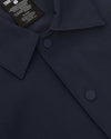 Navy Coaches Jacket with snap buttons and pointed collar.