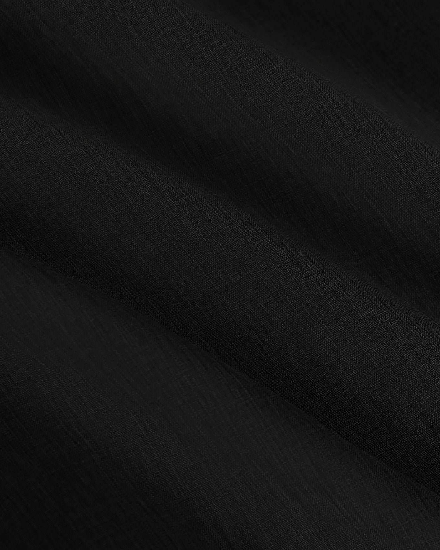 Black Active Shell Jacket showcasing soft folds and fine textured weave.