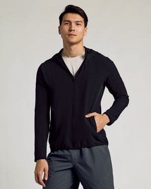 Young man modeling Active Shell Jacket—Lightweight, Water-Resistant Windbreaker by True Classic.