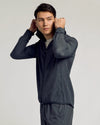 Young man in Charcoal Heather Gray Active Shell Jacket lifting hood.
