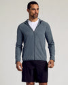 Heather Navy Active Shell Jacket with hood, zip pockets, and athletic shorts.
