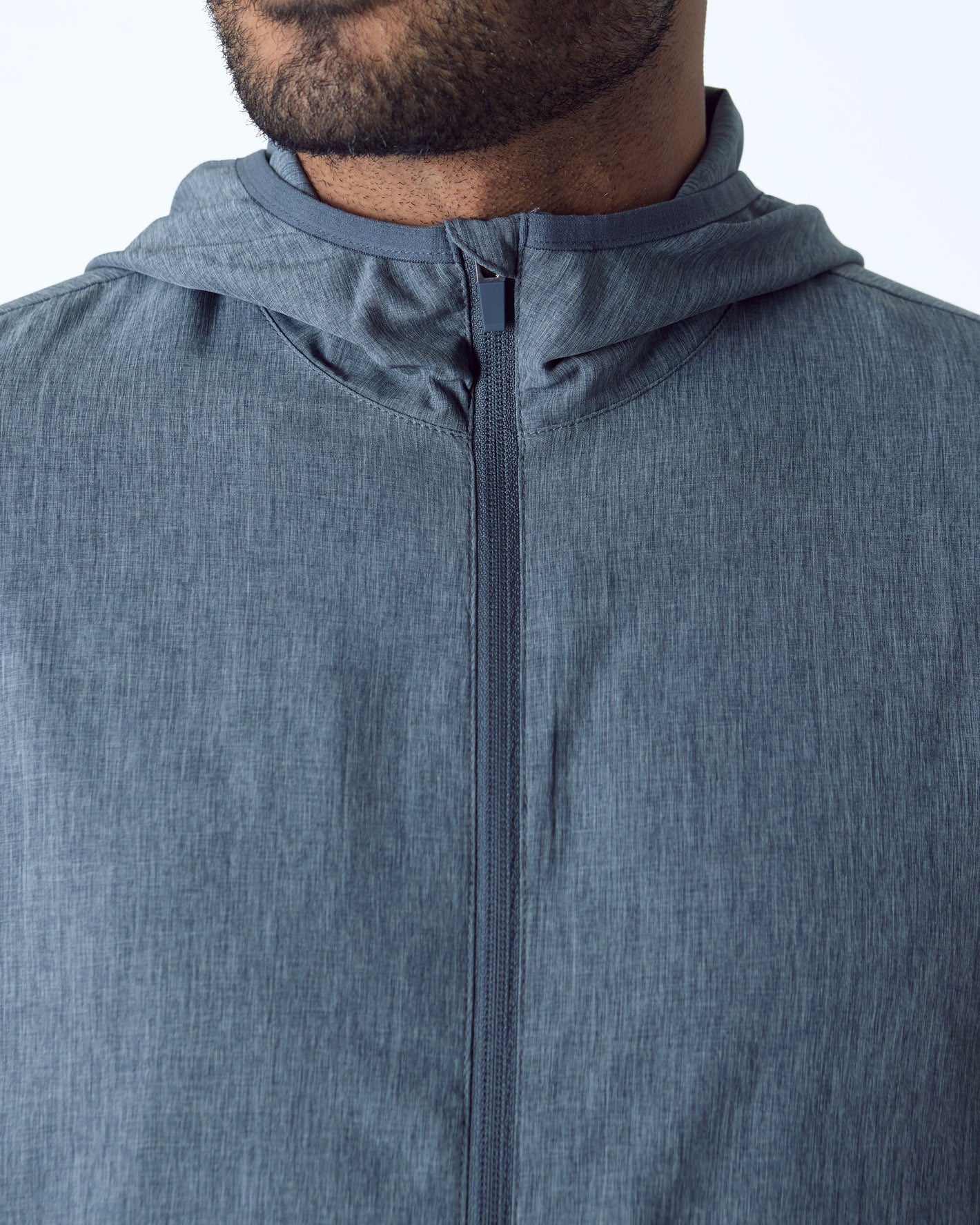 Heather Navy Active Shell Jacket close-up showing textured fabric and central zipper.