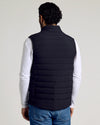 Black Puffer Vest over white shirt and jeans, showing quilted design.