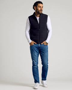 True ClassicBlack Puffer Vest worn over white T-shirt, paired with jeans.