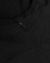 Black Tech Windbreaker close-up, highlighting YKK zipper and stitched fabric panels.