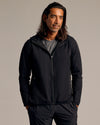 Man in Black Tech Windbreaker with hood and zip pockets.