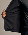 Black Tech Windbreaker showing interior lining and built-in pocket.