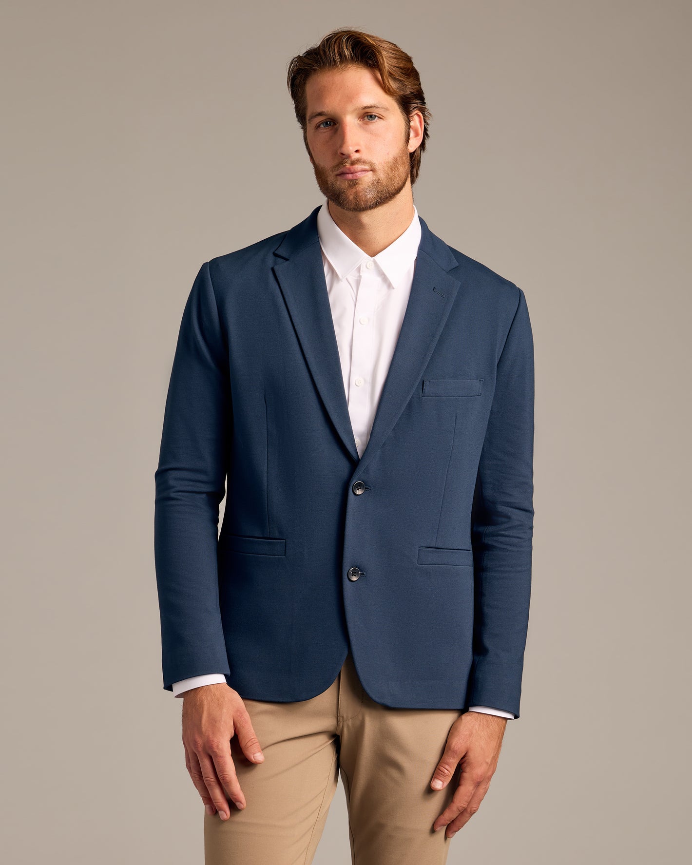 Navy Comfort Knit Blazer worn in a modern business-casual style.