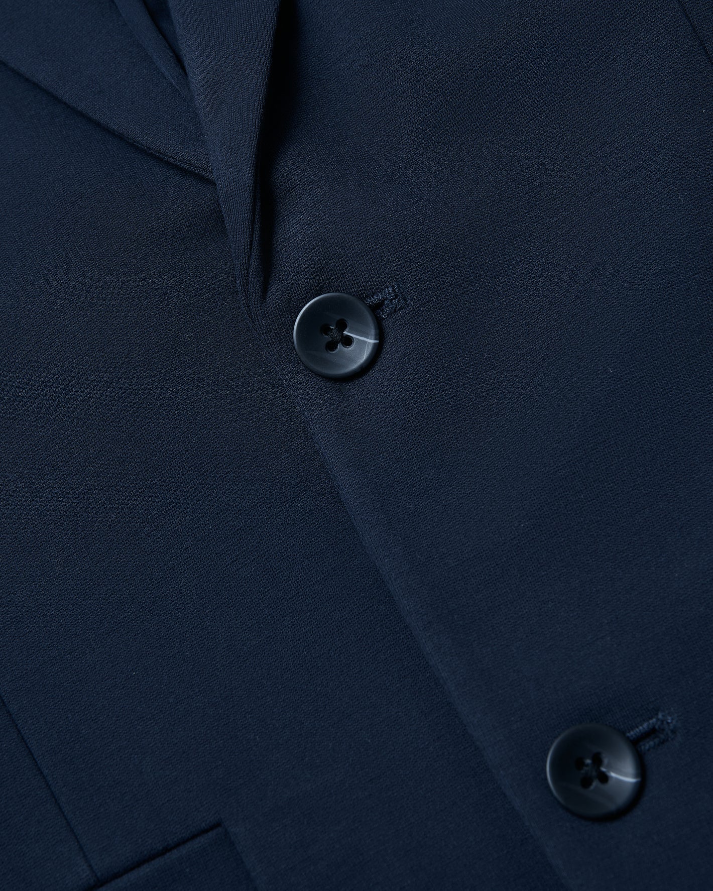 Navy Comfort Knit Blazer with textured fabric and tailored lapel.
