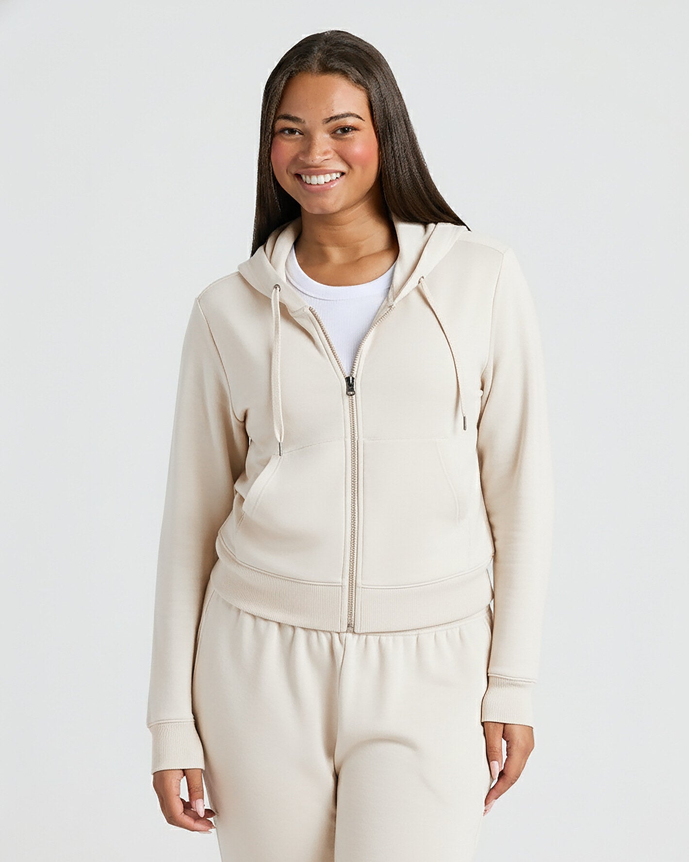 Young woman in Womens Oatmeal Crop Zip Hoodie.