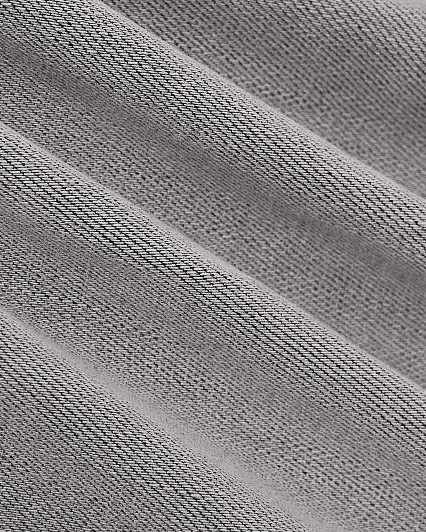 Medium Gray Wash Slim Comfort Stretch Jeans close-up, showing twill-style weave.
