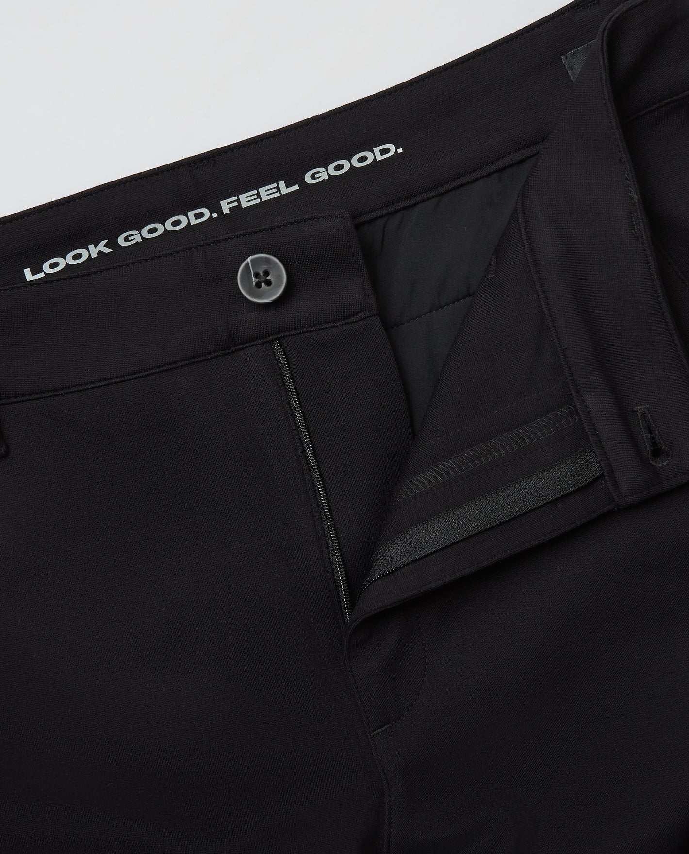 Black & Navy Slim Comfort Knit Chino Pant 2-Pack, partially opened zip and button.