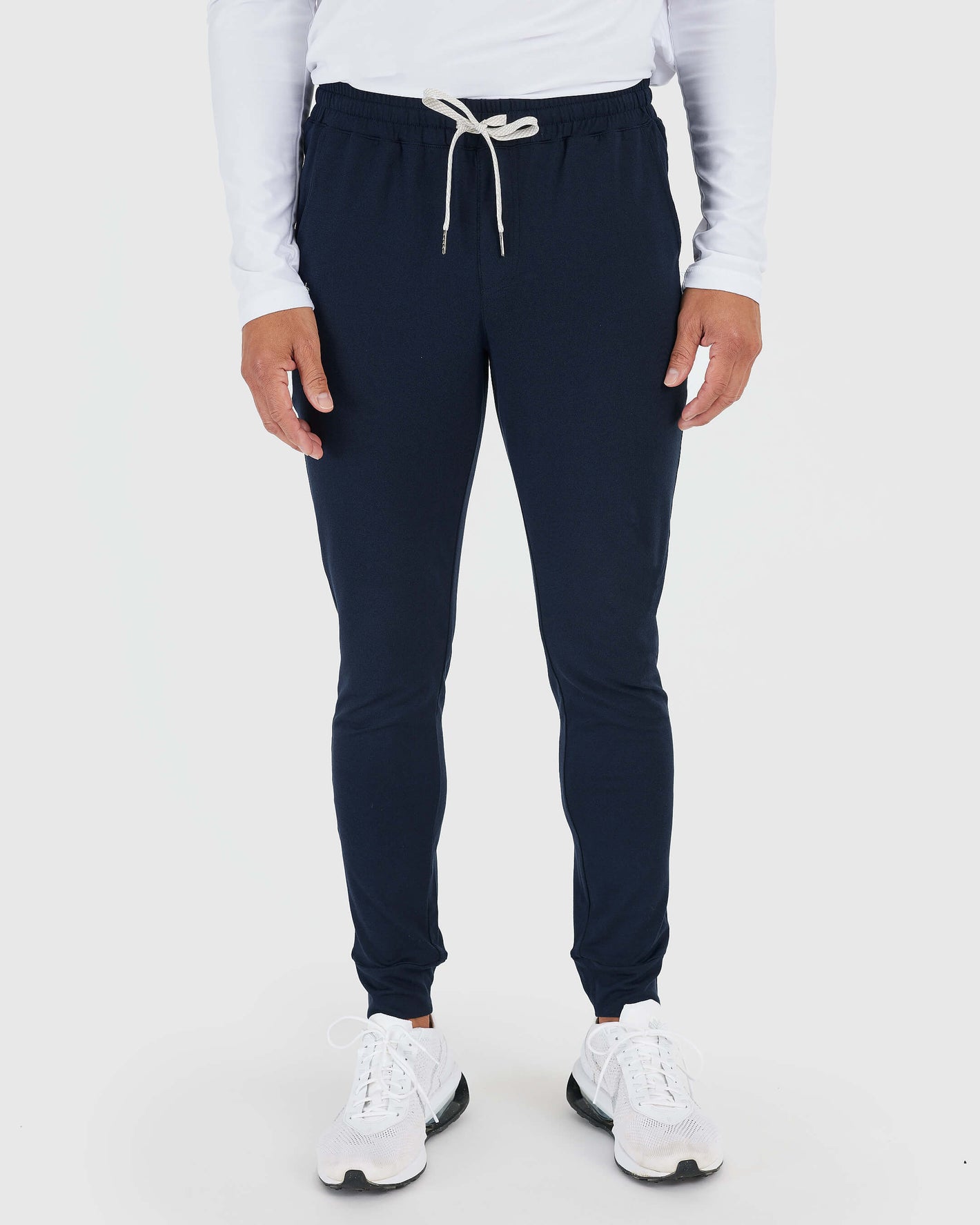 Active Sampler 3-Pack: navy joggers, white sneakers, white long-sleeve top.