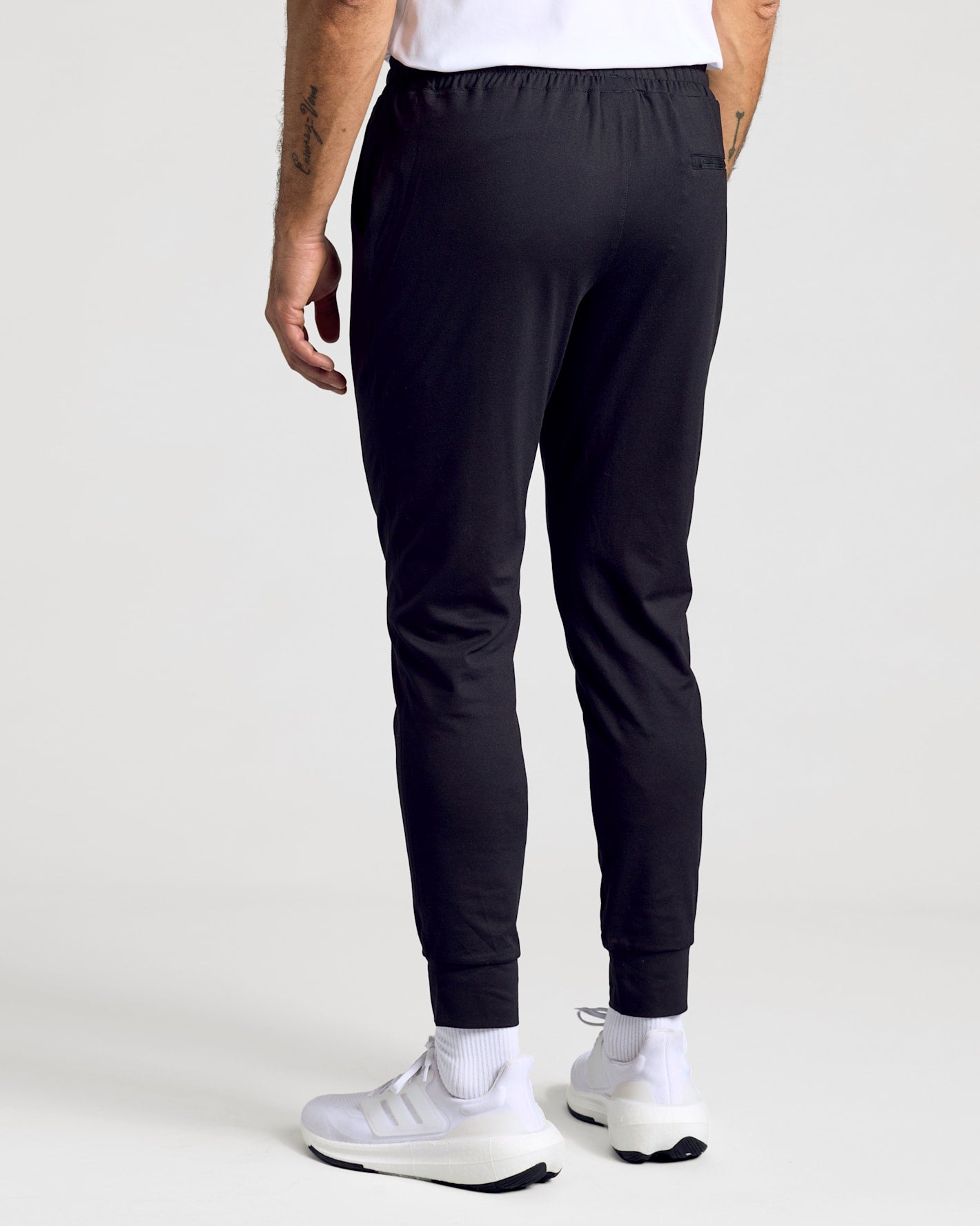 All Black Active Joggers 3-Pack modeled waist down, showcasing tapered ribbed cuffs.