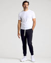 Man wearing All Black Active Joggers 3-Pack with white T-shirt and sneakers.
