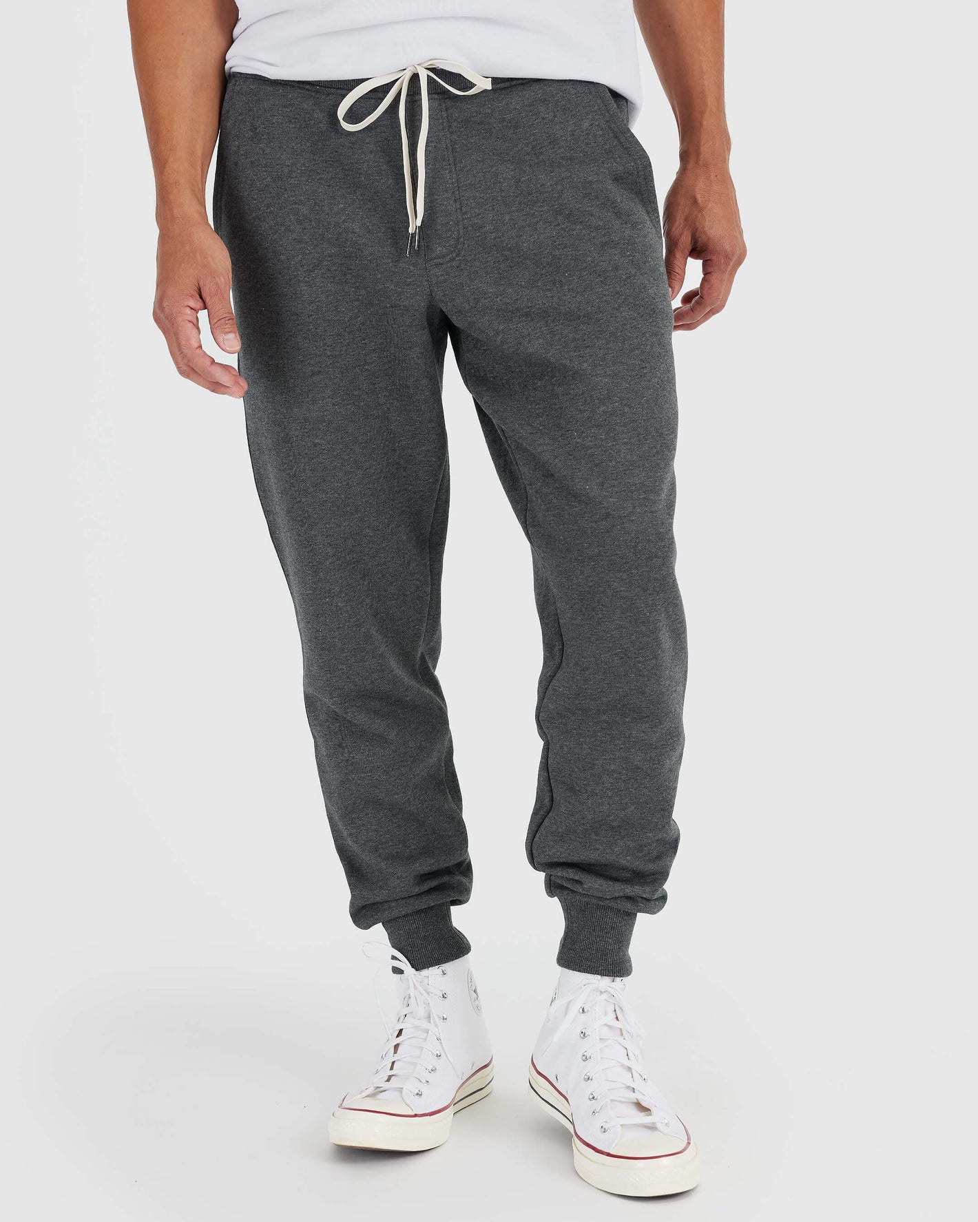 Charcoal Heather Gray Fleece French Terry Joggers with white sneakers.