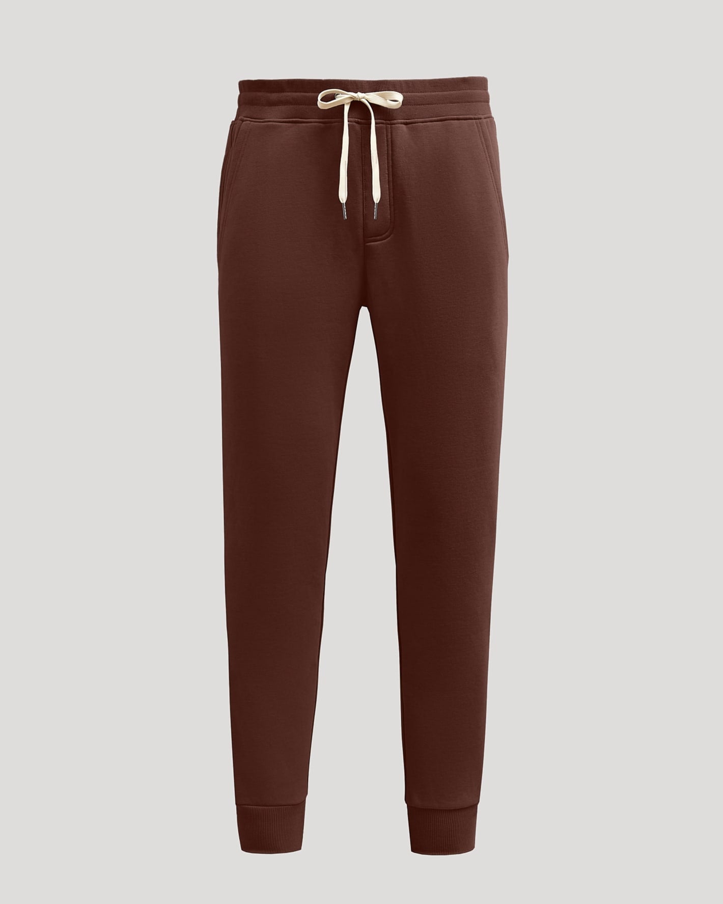 Carob Fleece French Terry Joggers with elastic waist, drawstring, and pockets.