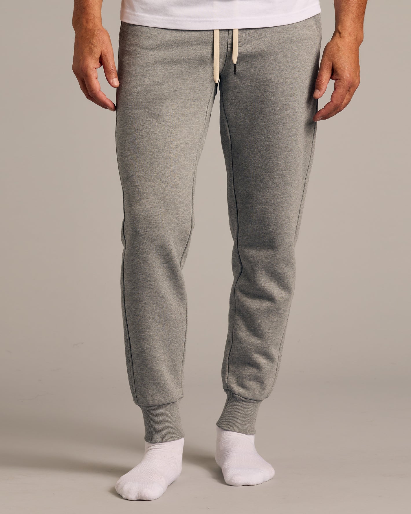 Model wearing heather-gray joggers from 3 Day Travel Pack.