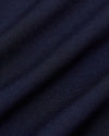 Navy Commuter Pants fabric with fine diagonal weave and soft folds.