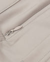Sandstone Commuter Pants pocket with zipper and precise stitching detail.