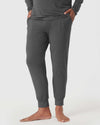 Charcoal Heather Gray Jogger from Loungewear Set, model barefoot, hands in pockets.