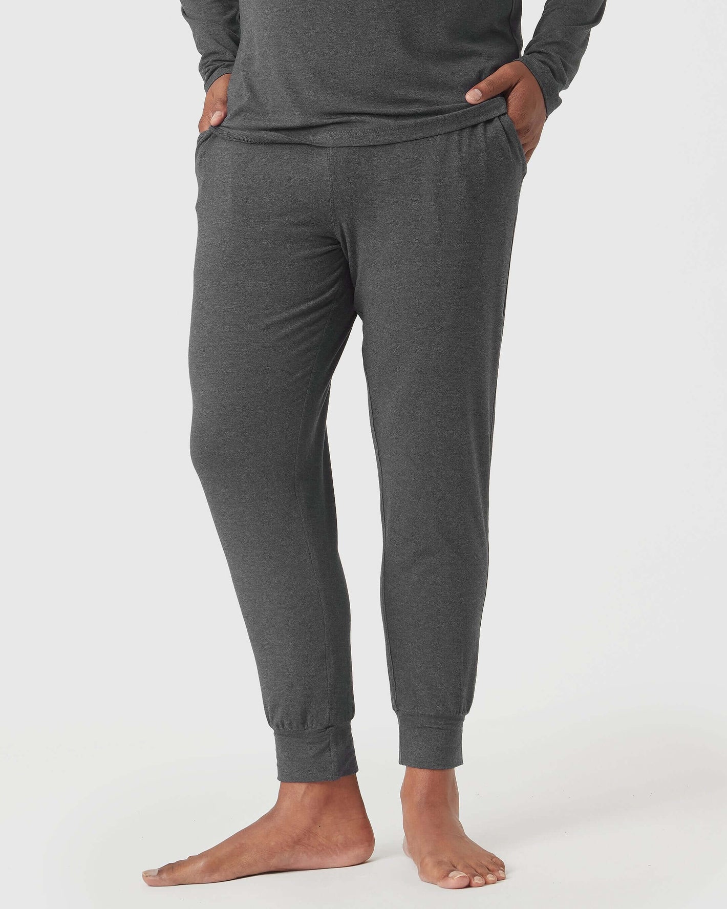 Charcoal Heather Gray Jogger from Loungewear Set, model barefoot, hands in pockets.