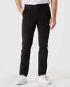 Black Slim Twill Chino Pant with white sneakers in a studio setting.