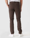 Back view of Dark Oak Slim Twill Chino Pant with sneakers.