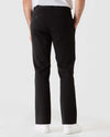 Black Straight Twill Chino Pant, back view, with white T-shirt and sneakers.
