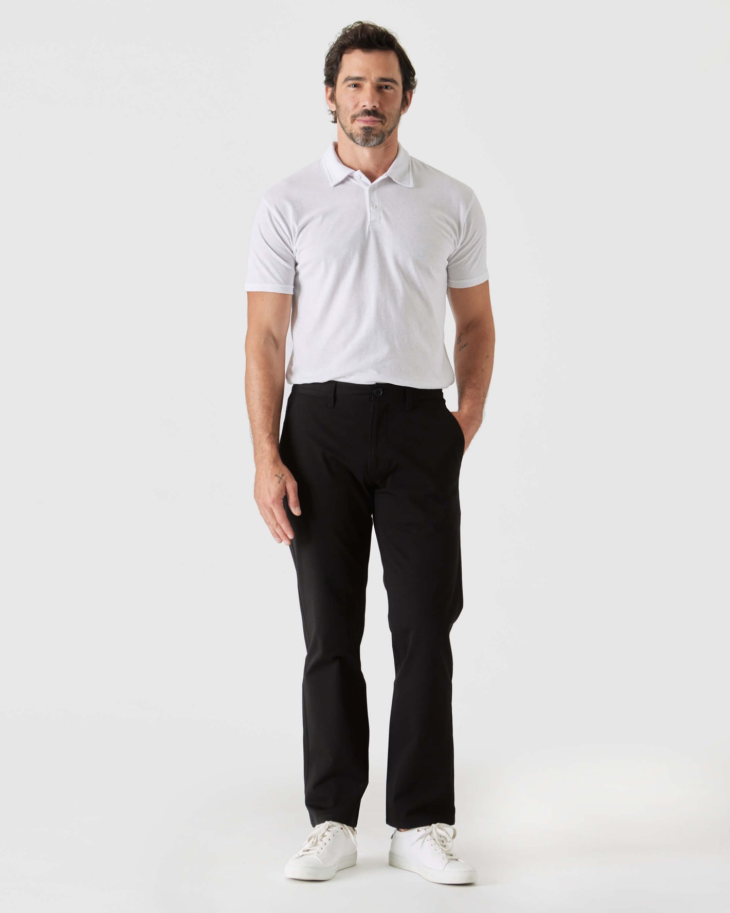 Man wearing Black Straight Twill Chino Pant with white polo.