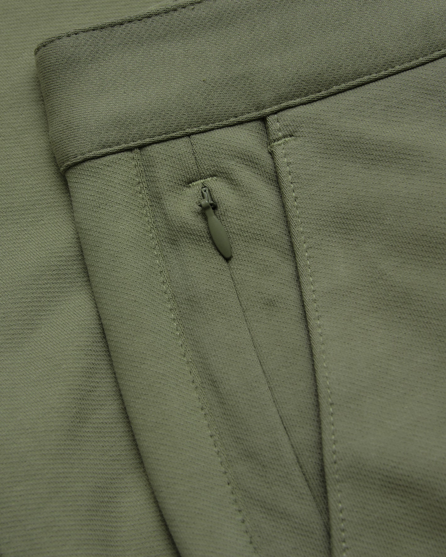 Military Green Slim Chino Pants 2.0 waistband, zippered pocket detail.