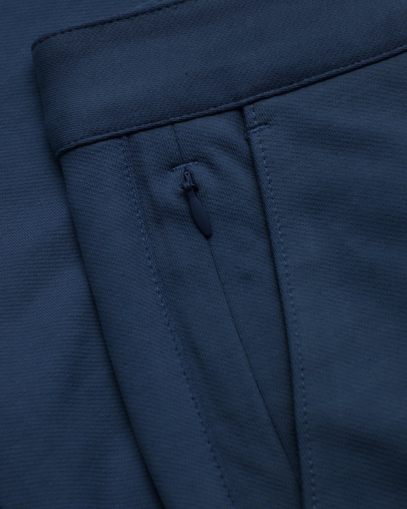 Navy Slim Chino Pants 2.0 with stitched waistband and zip pocket detail.