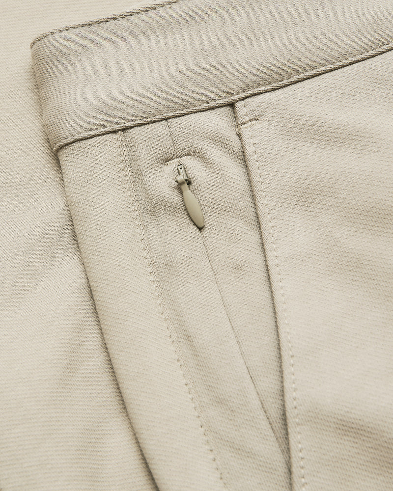 Sandstone Straight Chino Pants 2.0 showing waistband and zip pocket detail.