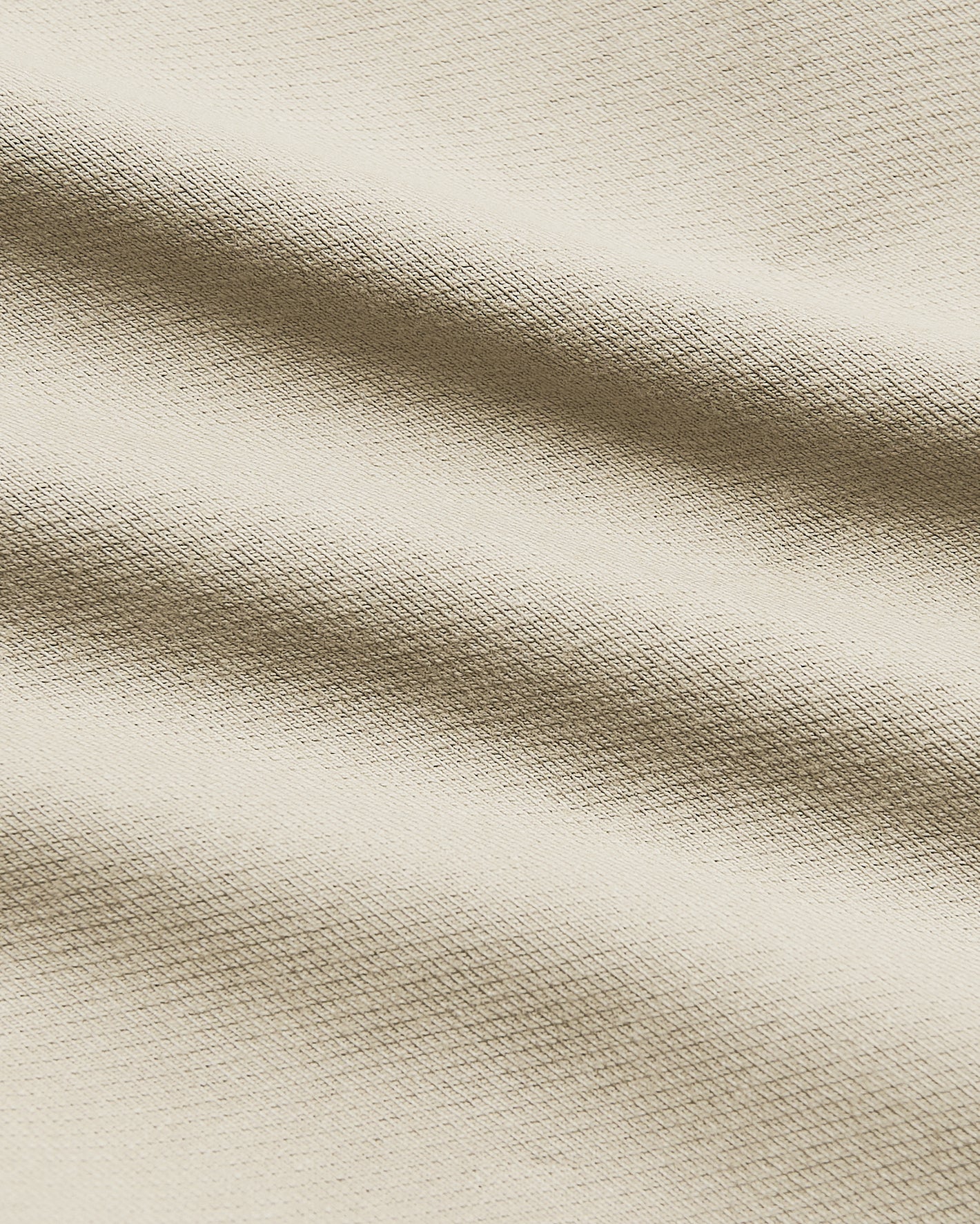Sandstone Straight Chino Pants 2.0 fabric close-up showing knit texture.