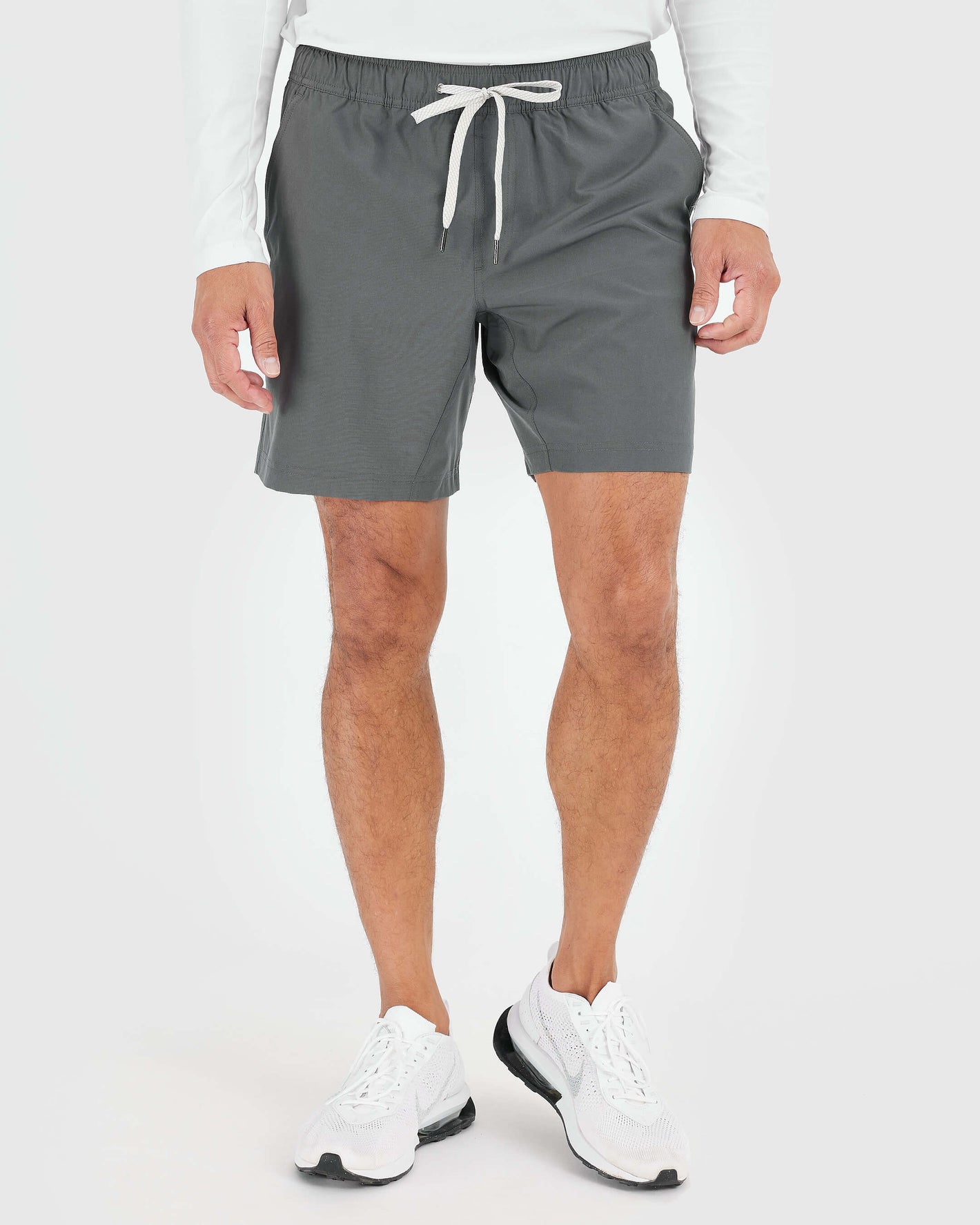 Man wearing Black and Carbon Active Quick Dry Shorts with white drawstring.