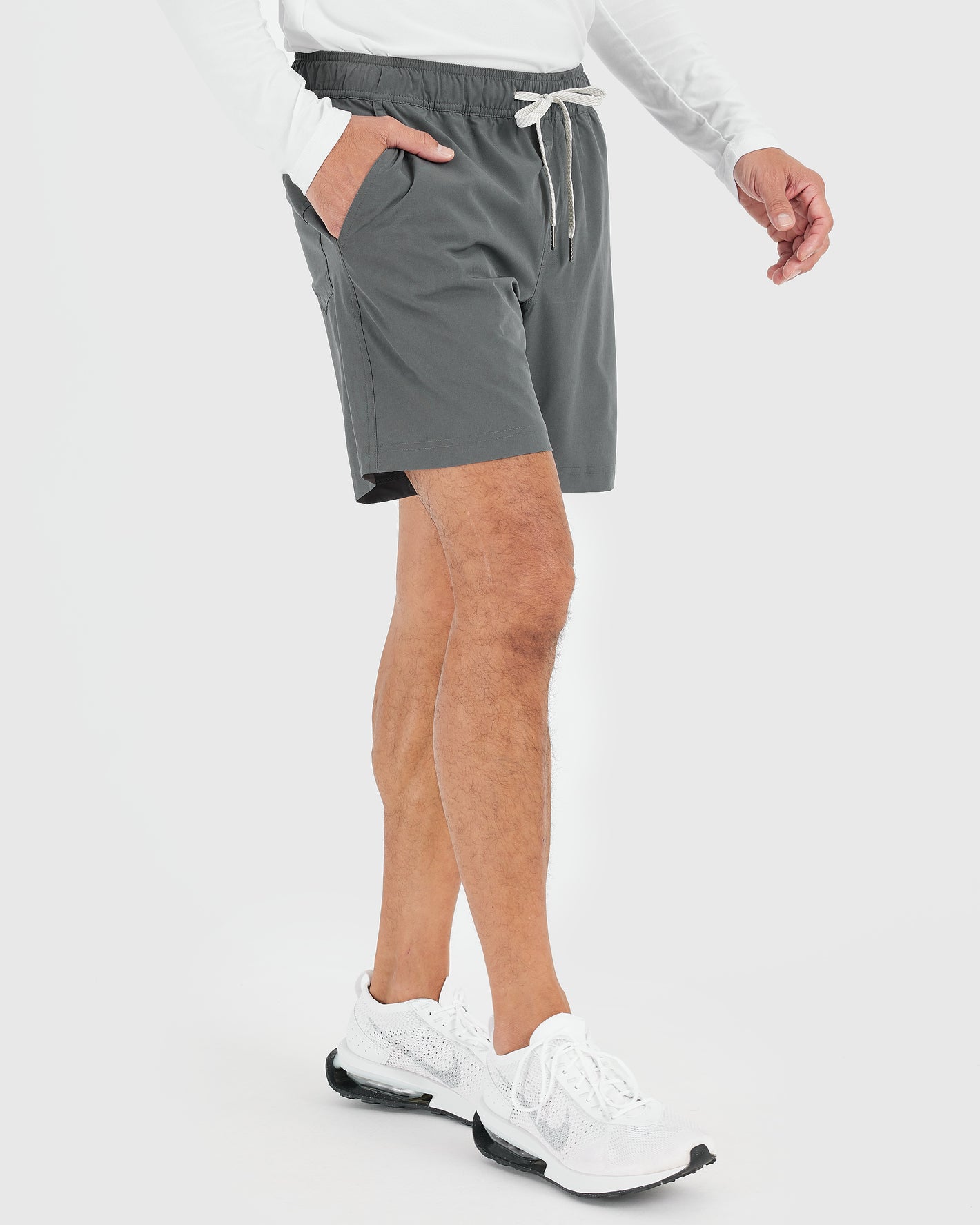 7 All Carbon Active Quick Dry Shorts with sneakers.