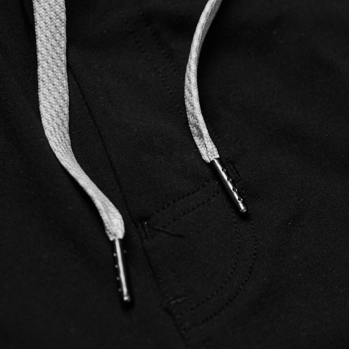 Close-up of Basic Active Comfort Shorts' braided drawcords with metal aglets.
