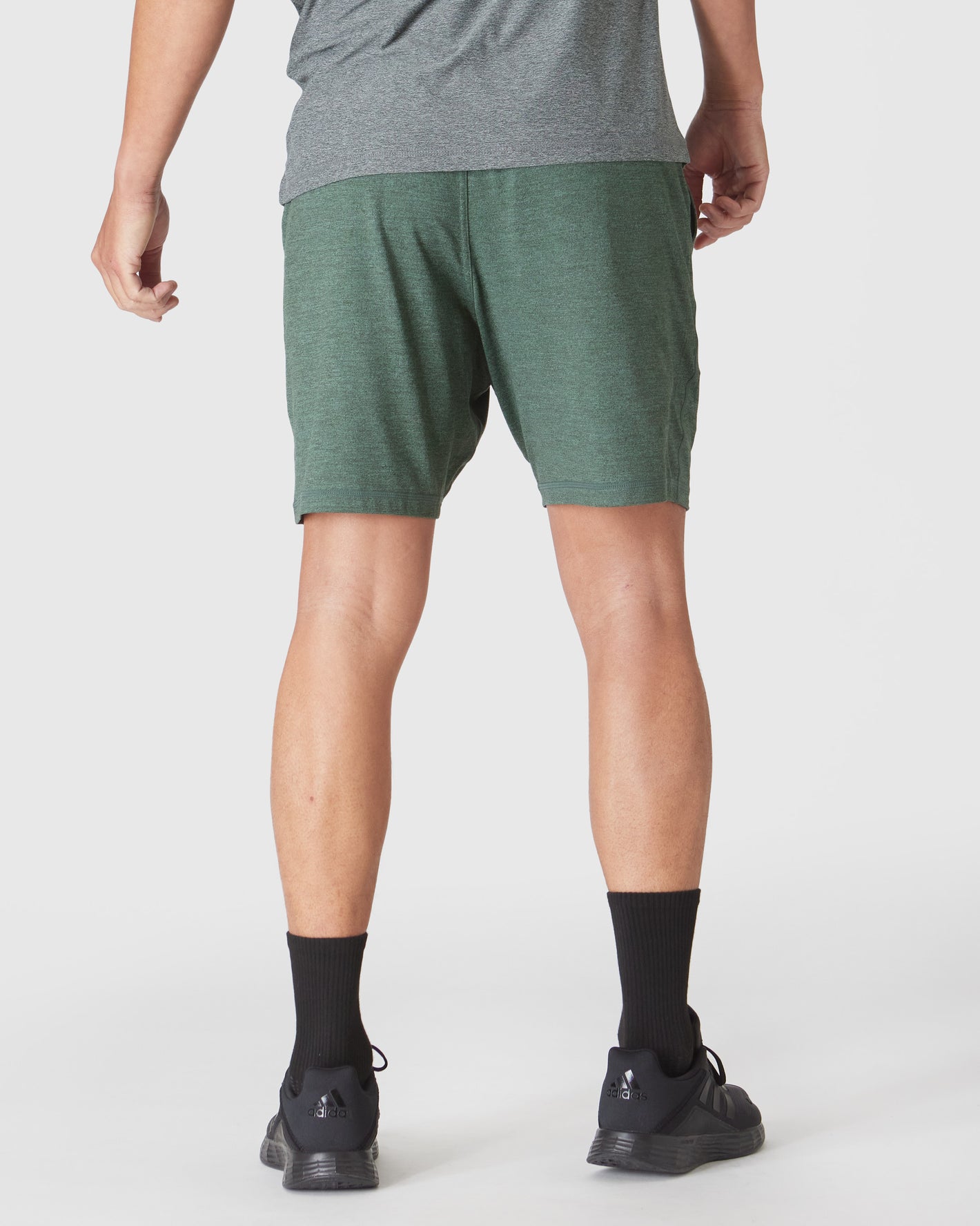 Heather Forest Active Comfort Shorts worn with gray T-shirt and black Adidas shoes.