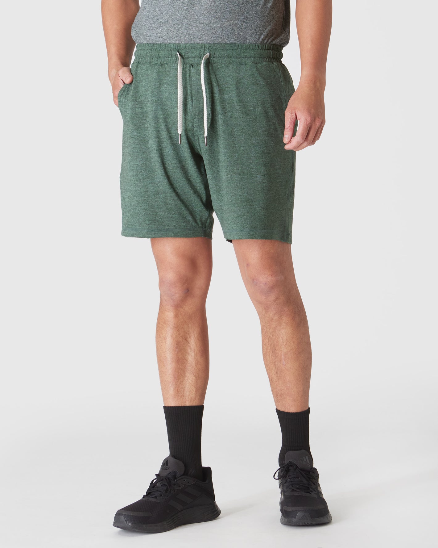 Heather Forest Active Comfort Shorts worn with black socks and sneakers.