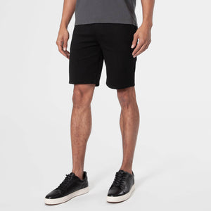 9 Black Comfort Knit Chino Shorts on a standing man.