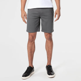 Carbon Comfort Chino Short worn with black sneakers.