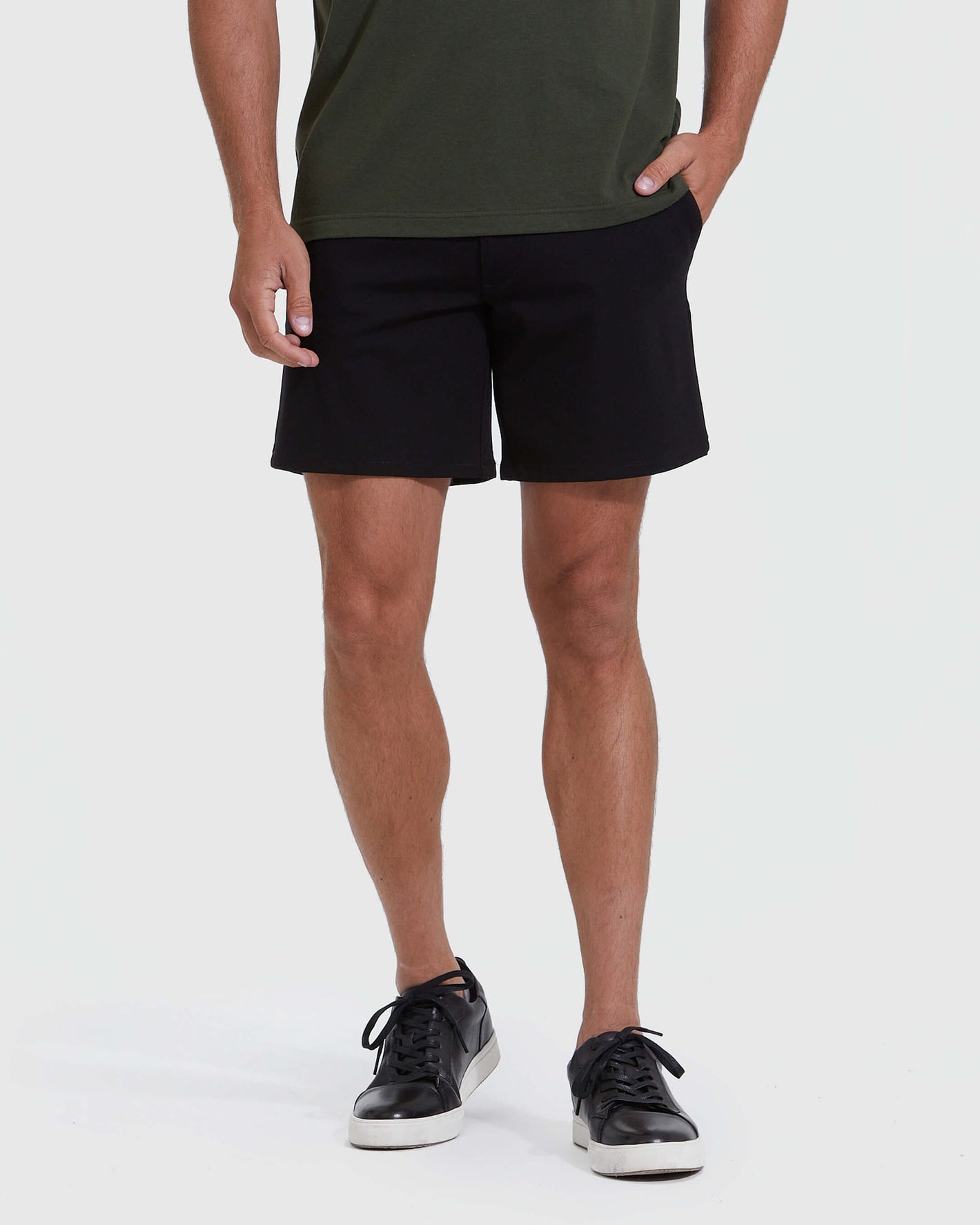 Black Commuter Short worn by model with hand in pocket.