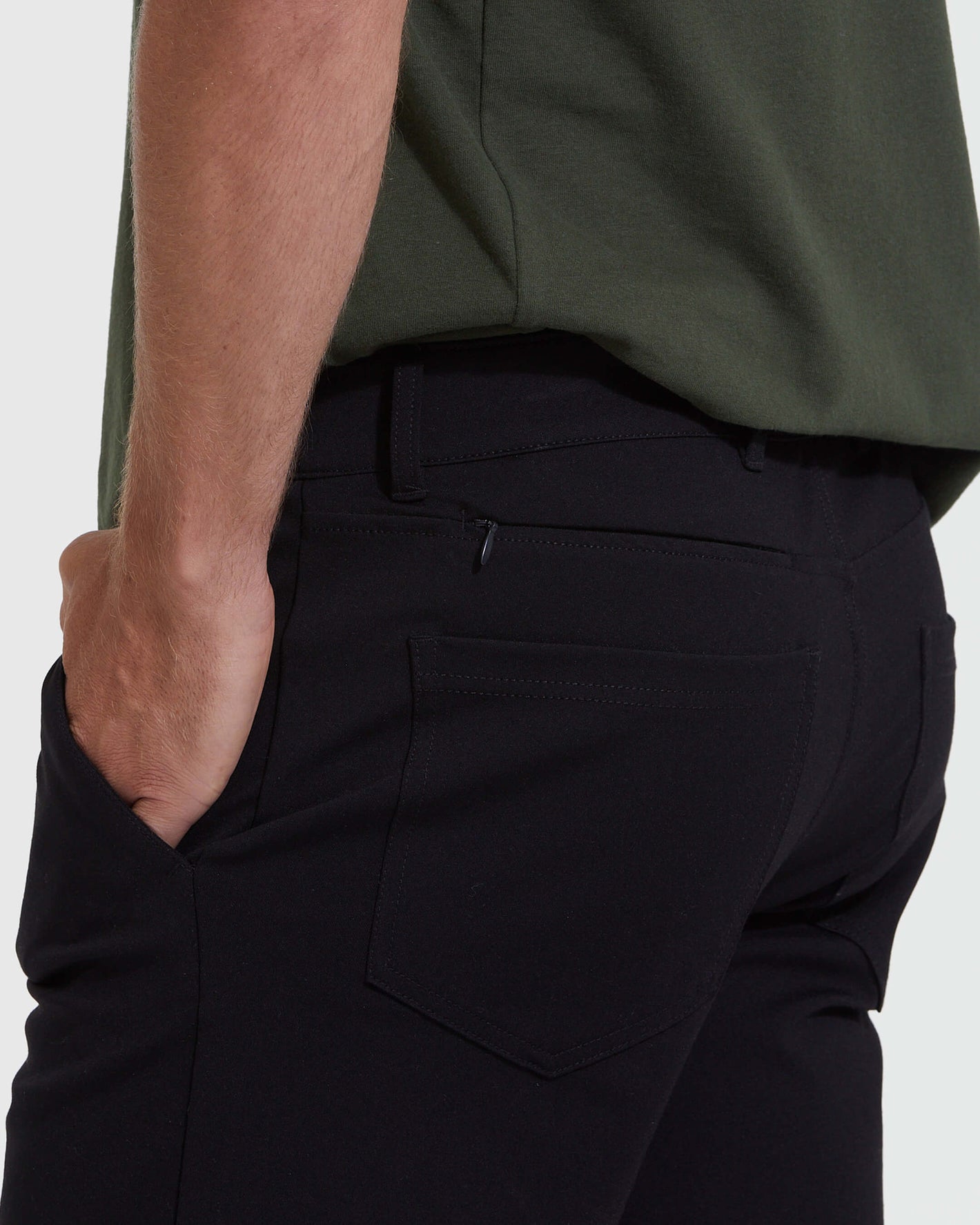 Black Commuter Short with back patch pocket and subtle zippered detail.