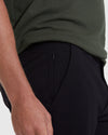 Black Commuter Short with zippered pocket, worn with dark green shirt.