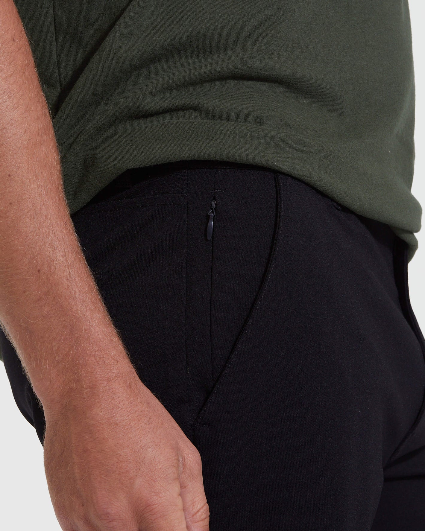 Black Commuter Short with zippered pocket, worn with dark green shirt.