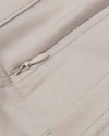 Sandstone Commuter Short with concealed zipper and precise stitching detail.