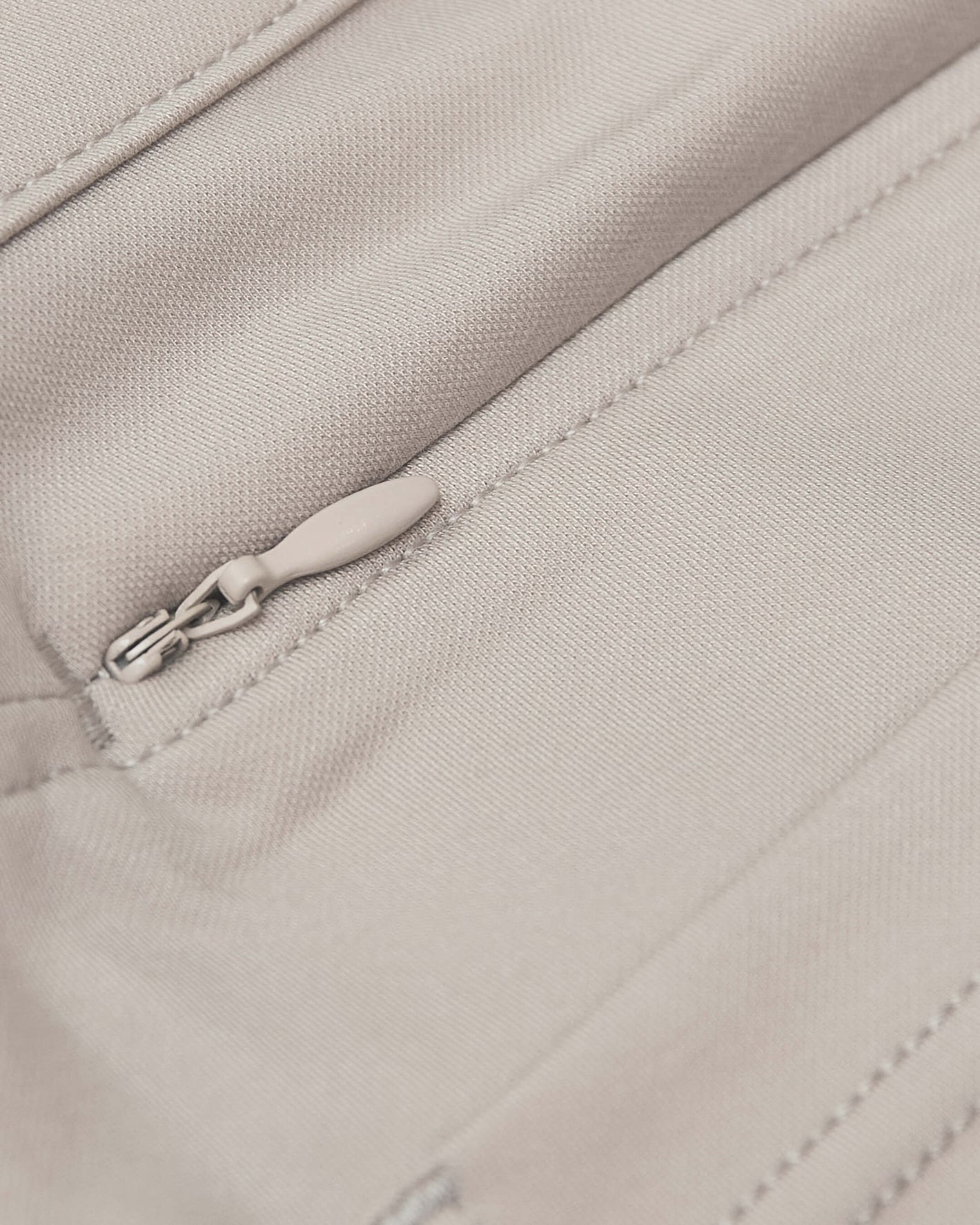 Sandstone Commuter Short with concealed zipper and precise stitching detail.